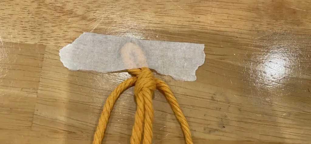 Begin a half square knot