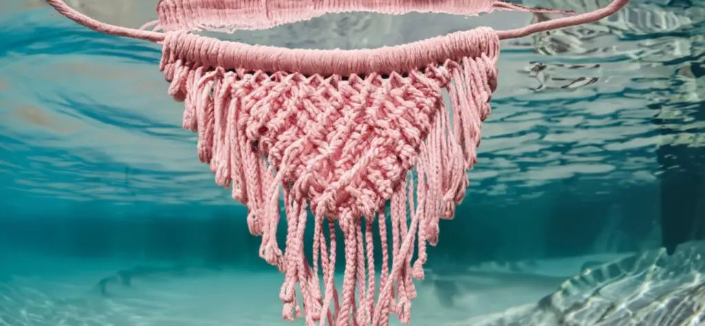 Pink macrame submerged in water