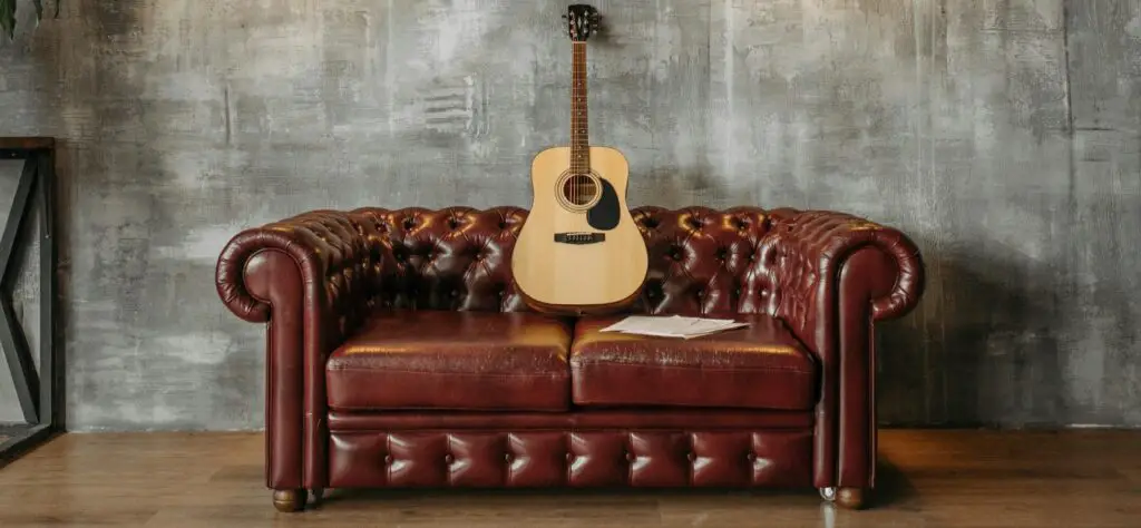 Chesterfield Sofa with an Acoustic Guitar