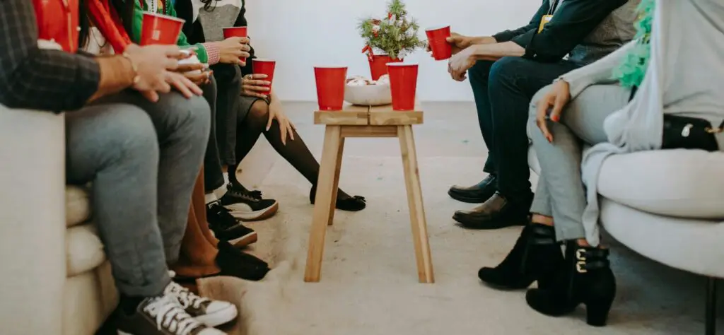 People sat on sofas having a party