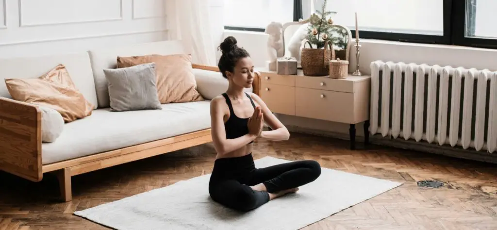 A girl doing yoga in her living room